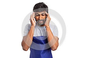 Store manager with migraine touching temples