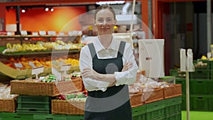 Store manager shows groceries department smiling closeup