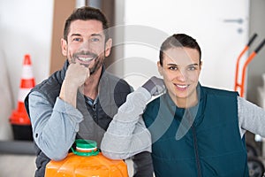 store manager with warehouseman checking goods reception