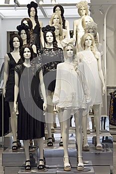 Store mannequins dressed in black and white boho dresses