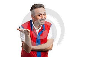 Store owner making obvious solution gesture with palm