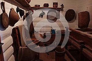 Store-room of richer slovak peasant from 19th century, boiled potato press on the floor.