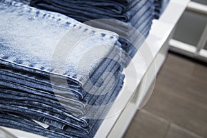 A store that sells jeans. Jeans on the counter of the store