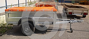 A store that sells trailers.Car open trailer. Transport for cargo transportation