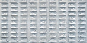 Store wall with large group of sneakers
