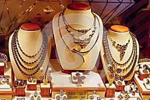 Store Window Display of Gold and Garnet Jewelry