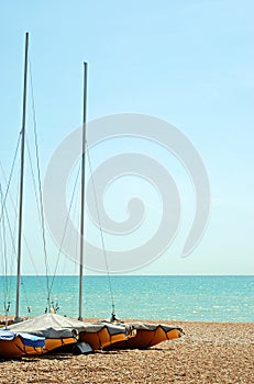 Stored sailboats on the beach photo