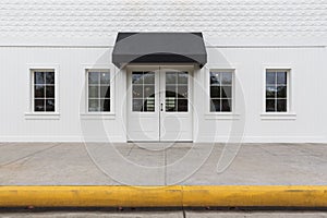 Storefront building with black awning