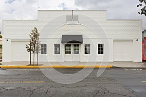 Storefront building with two garages