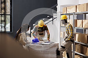 Storehouse employees preparing order and chatting in storage room