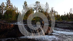 Storforsen smaller rapids flowing over rocks in Sweden photo