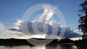 Summer cloud at Storforsen rapids waterfall in Sweden photo