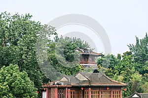 Storied building and pavilion