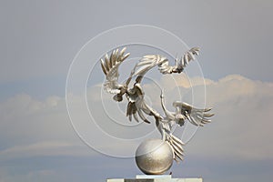 Storks on the arch in Tashkent photo