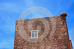 Storks on the city gate building, Silves, Portugal.