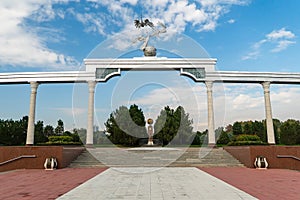 Storks flying over the globe in the Ezgulik Arch of Good and Noble Aspirations at Independence square, Tashkent city in