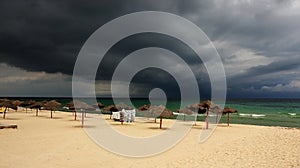 Storm approaching over a tropical beach