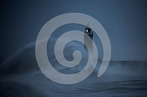 Storm Arwen batters the coastline at Tynemouth, England, with giant waves crashing against the lighthouse in the gale force winds