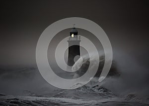 Storm Arwen batters the coastline at Tynemouth, England, with giant waves crashing against the lighthouse in the gale force winds