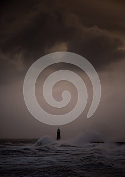 Storm Arwen batters the coastline at Tynemouth, England, with giant waves crashing against the lighthouse in the gale force winds