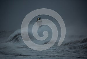 Storm Arwen batters the coastline at Tynemouth, England, with giant waves crashing against the lighthouse in the gale force winds