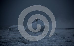 Storm Arwen batters the coastline at Tynemouth, England, with giant waves crashing against the lighthouse in the gale force winds