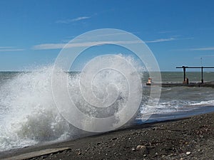 Storm on the beach at sunny day