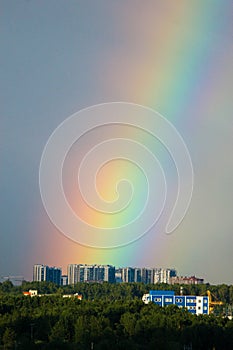 After the storm beautiful bright double rainbow over the city