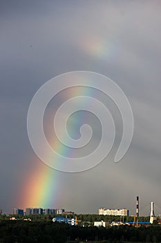 After the storm beautiful bright double rainbow over the city