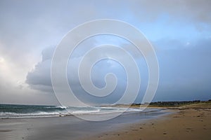 Storm cloud above beach