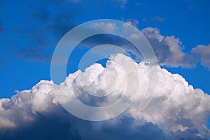 Storm clouds in blue sky