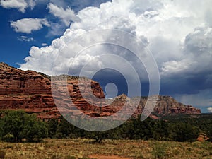 Storm clouds build behind the Sedona red rocks