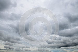 Storm clouds floating in a rainy day with natural light. Cloudscape scenery, overcast weather above blue sky. White and grey