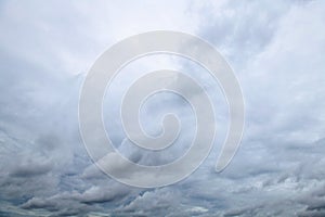 Storm clouds floating in a rainy day with natural light. Cloudscape scenery, overcast weather above blue sky. White and grey