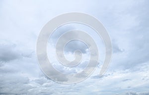 Storm clouds floating in a rainy day with natural light. Cloudscape scenery, overcast weather above blue sky. White and grey