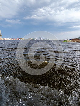 storm clouds forming over Riga cargo shipping port on river Daugava