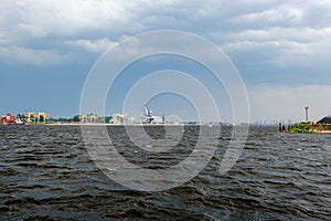 storm clouds forming over Riga cargo shipping port on river Daugava