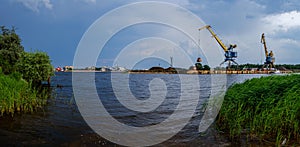 storm clouds forming over Riga cargo shipping port on river Daugava