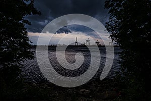 storm clouds forming over Riga cargo shipping port on river Daugava