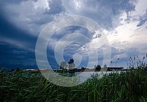 storm clouds forming over Riga cargo shipping port on river Daugava