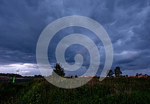 storm clouds forming over Riga cargo shipping port on river Daugava