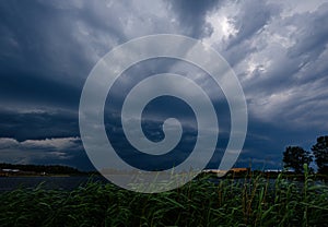 storm clouds forming over Riga cargo shipping port on river Daugava