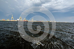 storm clouds forming over Riga cargo shipping port on river Daugava