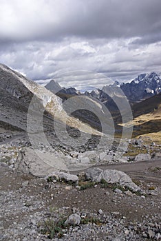 Storm clouds gather over broad glacial valley