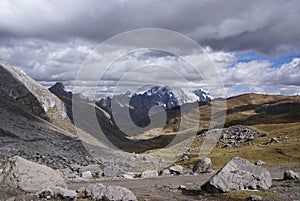 Storm clouds gather over broad glacial valley