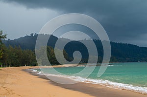 Storm clouds gathering over the jungle and beach of Khao Lak