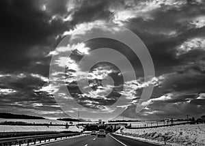Storm Clouds And Highway