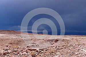 Storm clouds in the landscape of the Atacama Desert. The rocks of the Mars Valley Valle de Marte and Cordillera de la Sal, photo