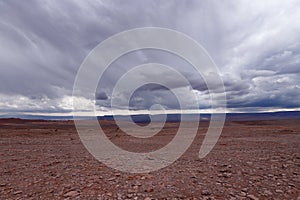 Storm clouds in the landscape of the Atacama Desert. The rocks of the Mars Valley Valle de Marte and Cordillera de la Sal, photo