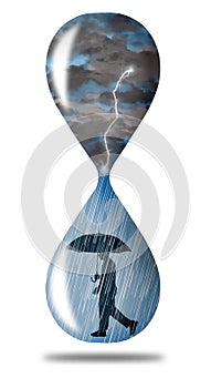 Storm clouds and lightning fill the top of an hourglass while rain falls on a man with with an umbrella in the bottom of the glass